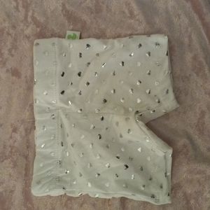 White baby shorts with sliver hearts on them